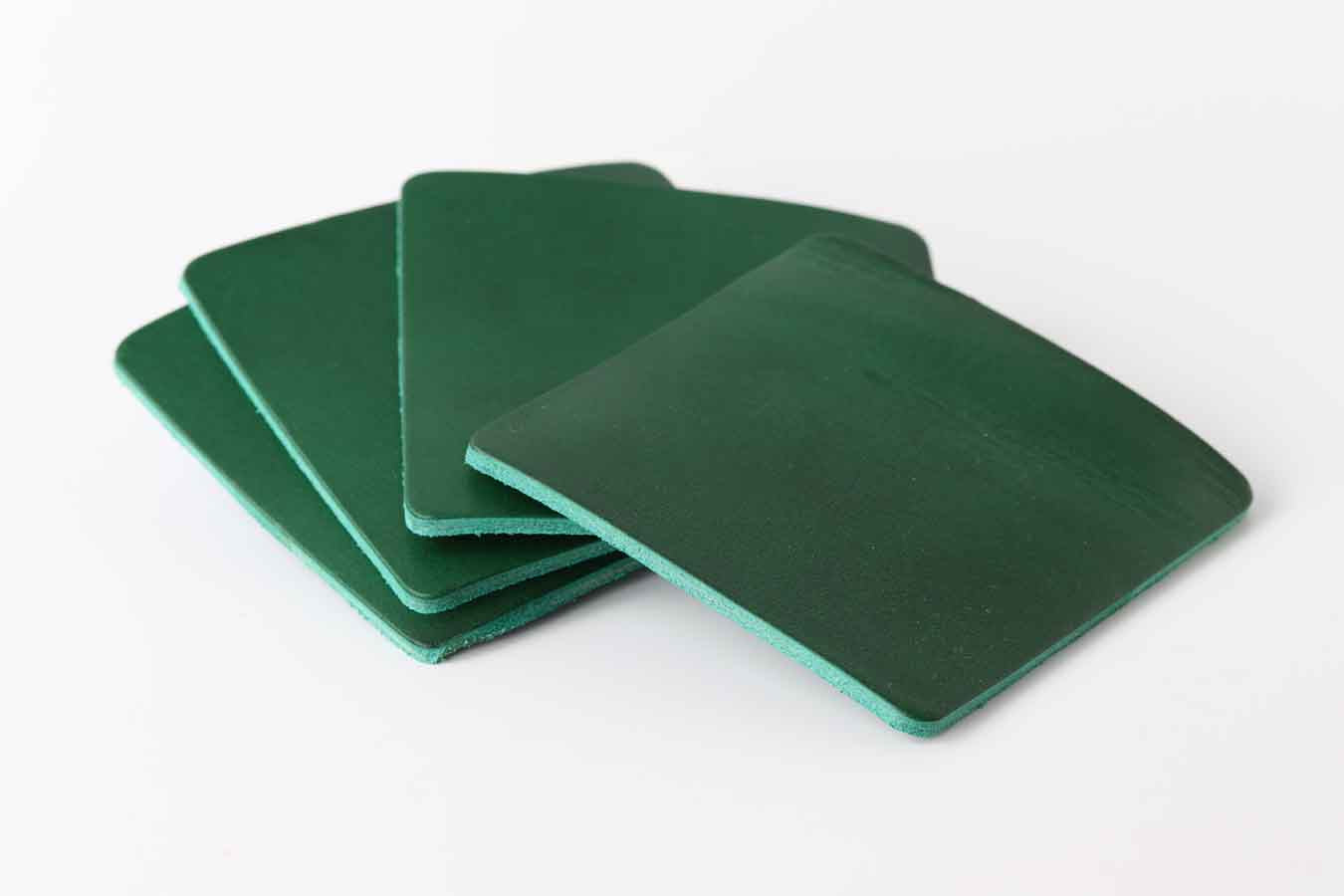 green leather coaster set
