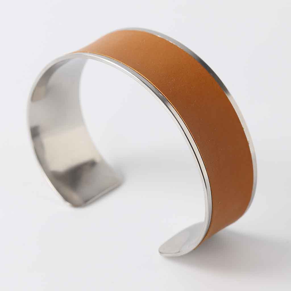 bracelet for women with slight bend crafted from stainless steel and tan leather by Kaseta