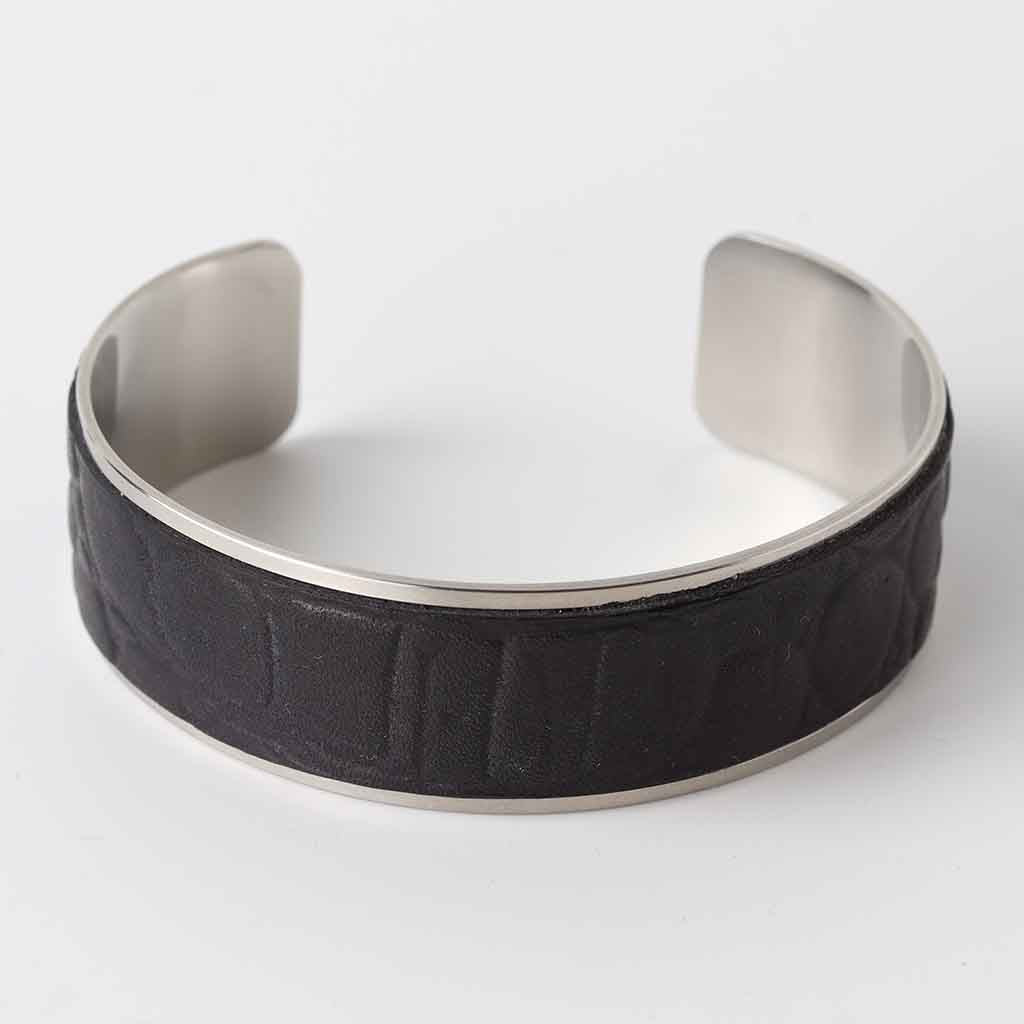 unisex cuff bracelet with stainless steel base and black leather by Kaseta