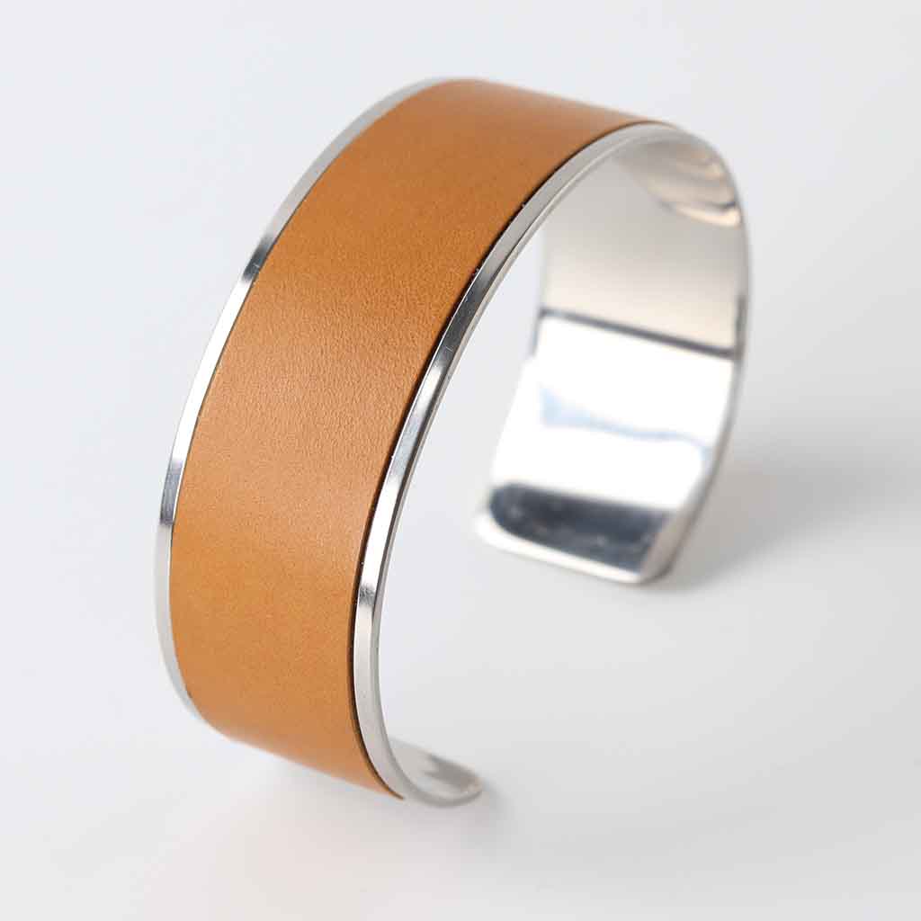 Ladies cuff bracelet with tan leather on polished stainless steel for silver look