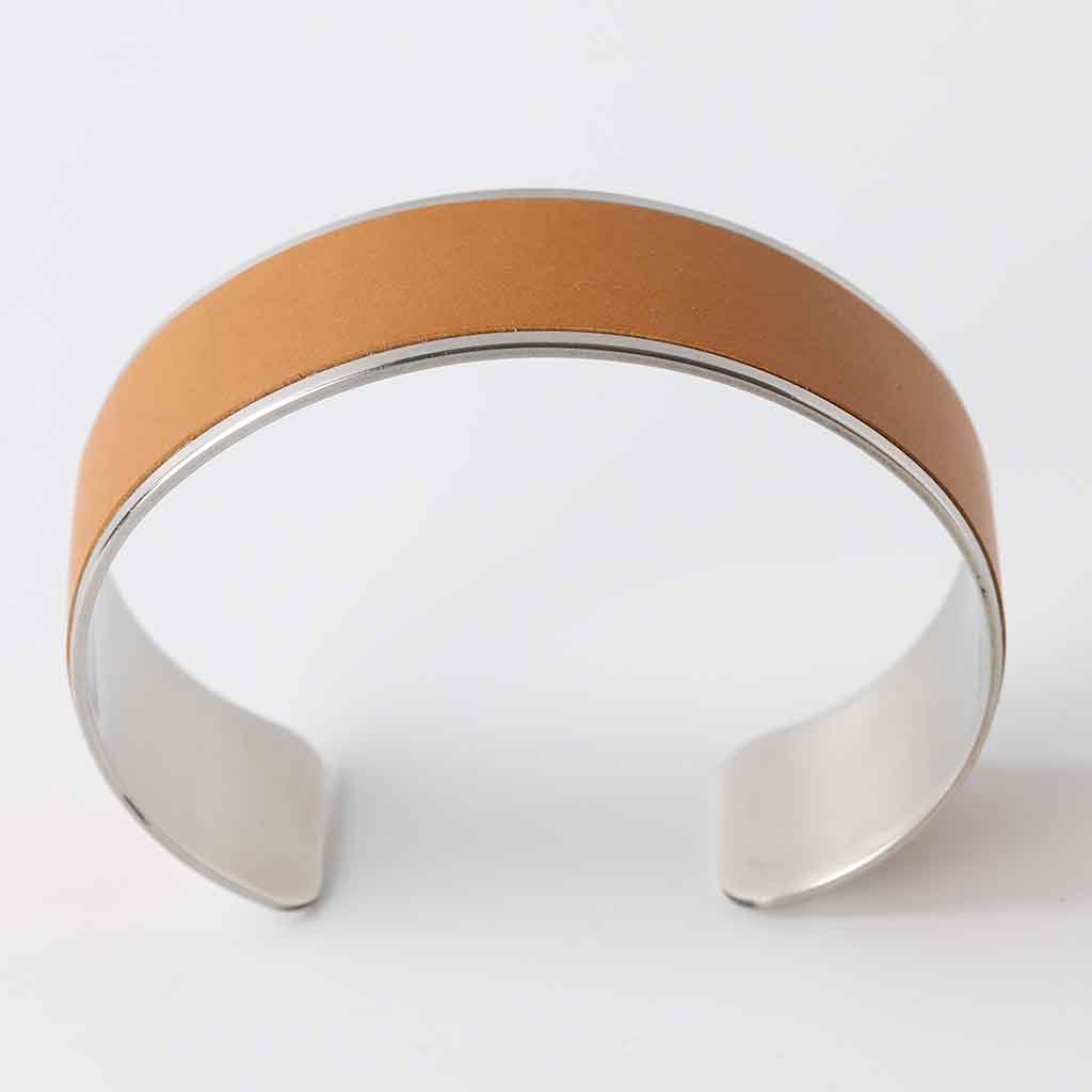 ladies bracelet with tan leather on silver polished stainless steel