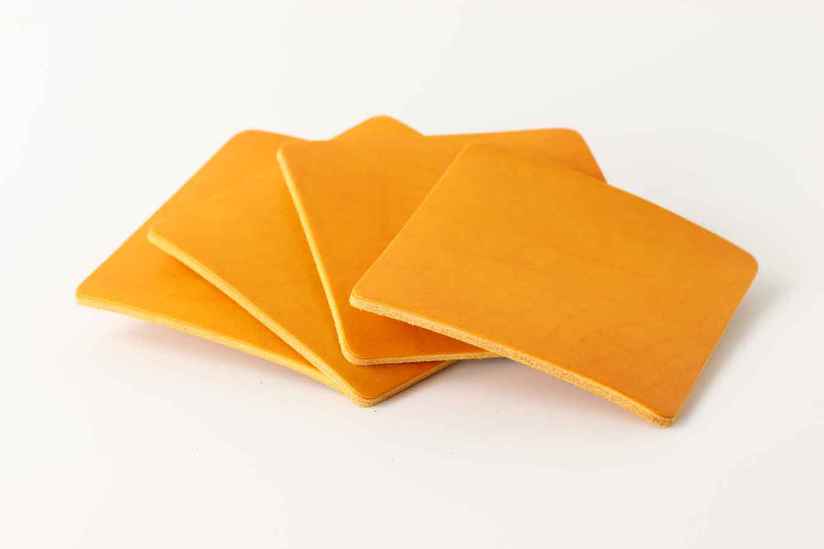 Yellow leather coasters set