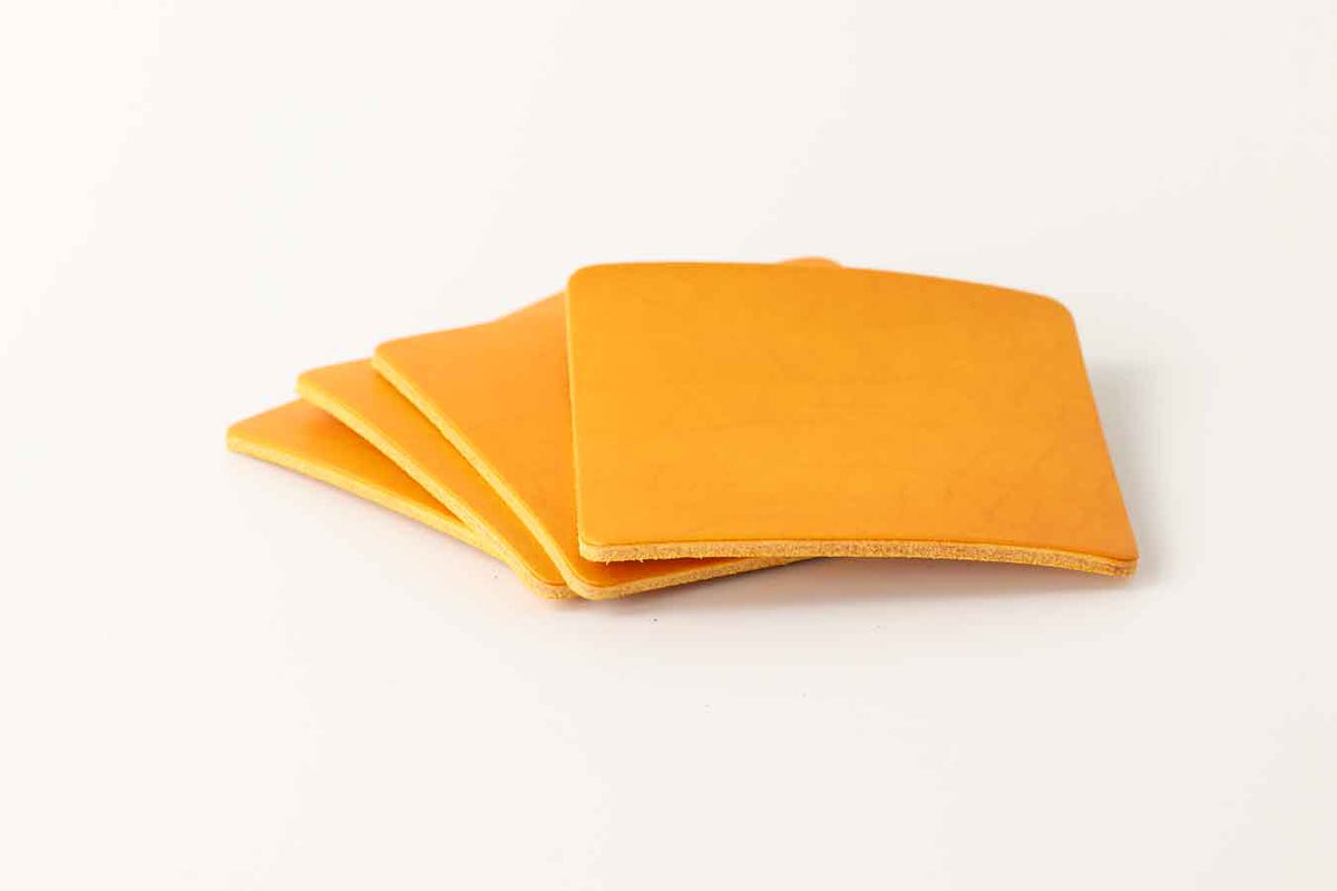 Yellow leather coasters set