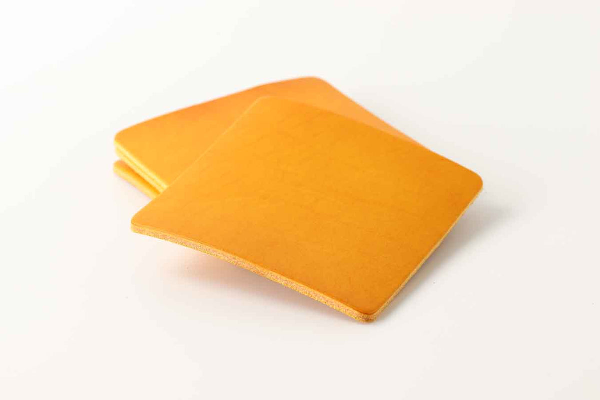 Yellow leather coasters set