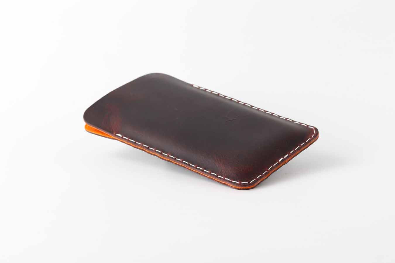 chocolate iPhone 15 leather sleeve with white stitching
