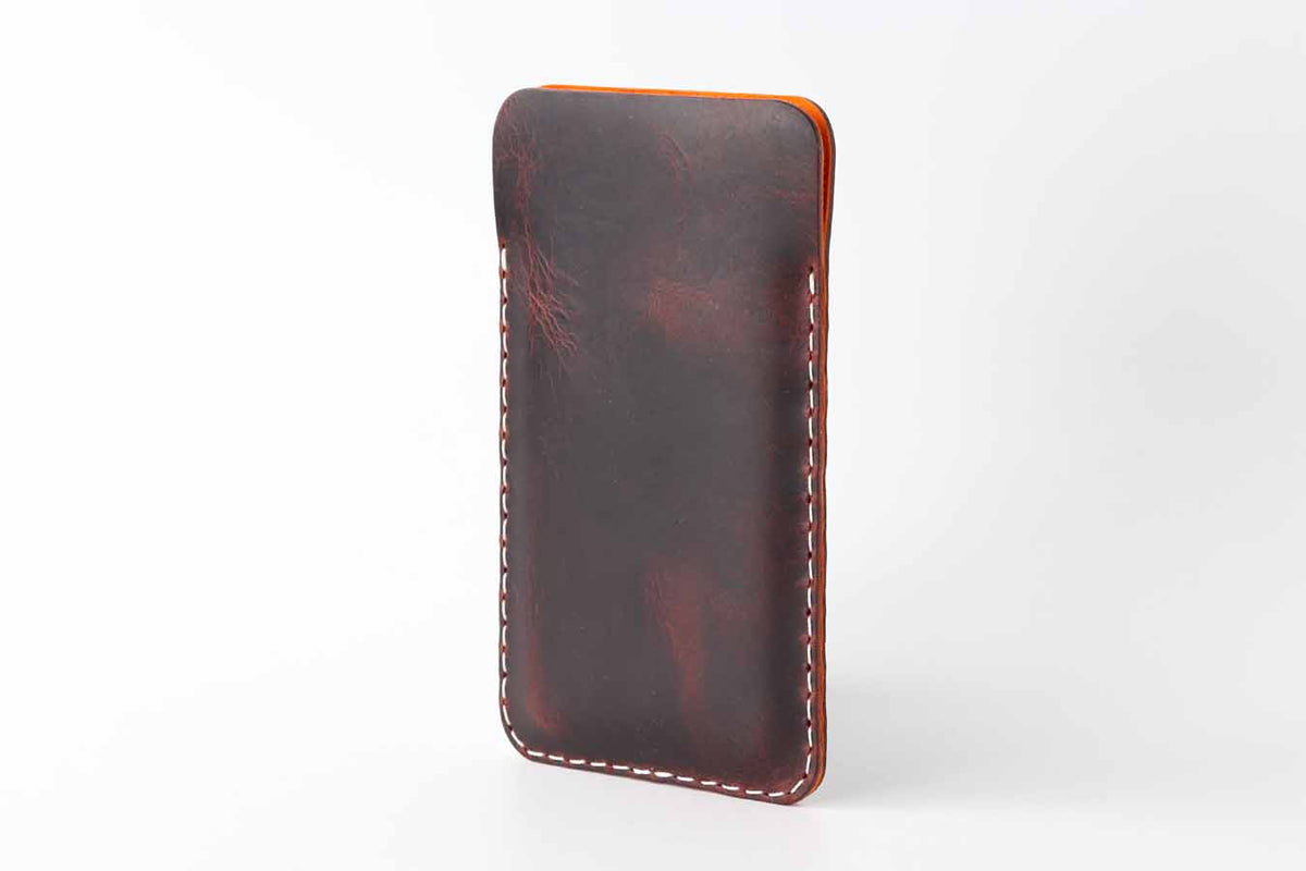 chocolate iPhone 15 and iPhone 15 pro leather sleeve with white stitching
